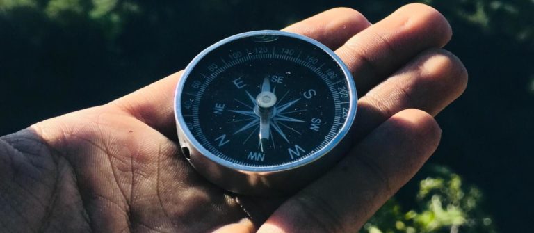 A compass represents staying the course on the content marketing road map.