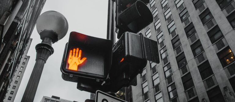A pedestrian stop signal on a traffic light represents the B2B content killers that can prevent engagement.