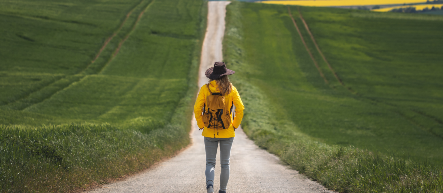 An image of a person walking on a long road represents the power of long-form content in B2B marketing.