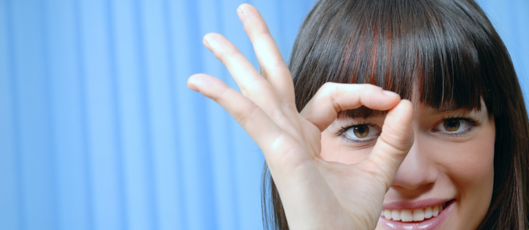 A woman with her fingers showing a zero illustrates that zero-click marketing isn't just another digital trend.