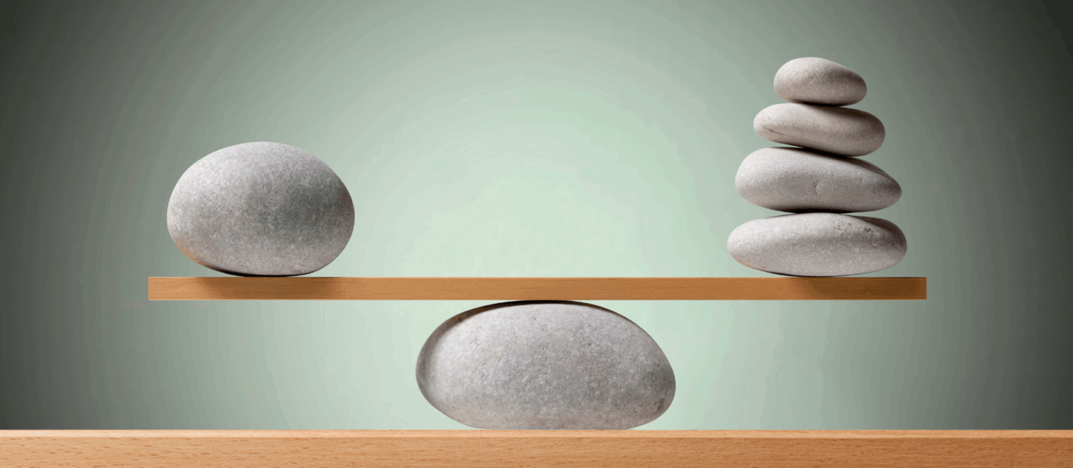 Stones on a board represent using KPIs and ROI together to measure marketing results.