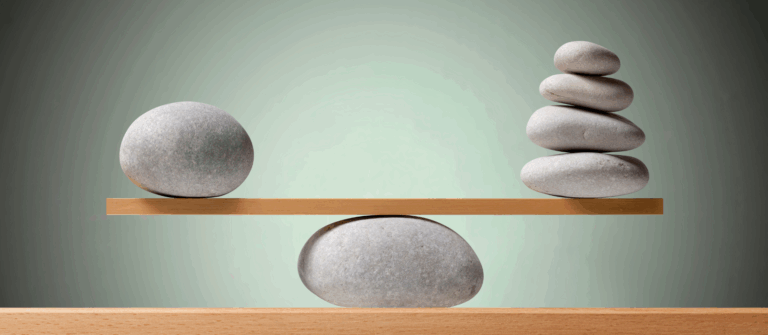 Stones on a board represent using KPIs and ROI together to measure marketing results.