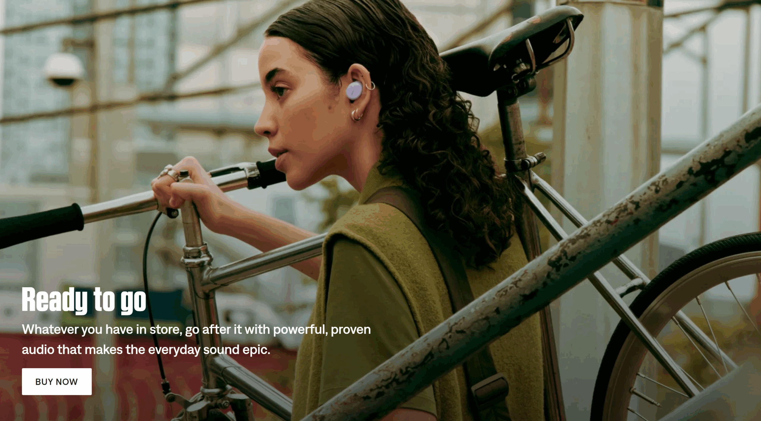 A screenshot from the Bose website of a woman listening to music with earbuds underscores how the brand focuses on • experiential outcomes.