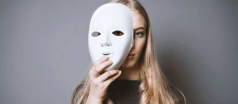 A woman holding a blank white mask in front of her face symbolizes hidden perspectives that relate to bias in AI marketing content.