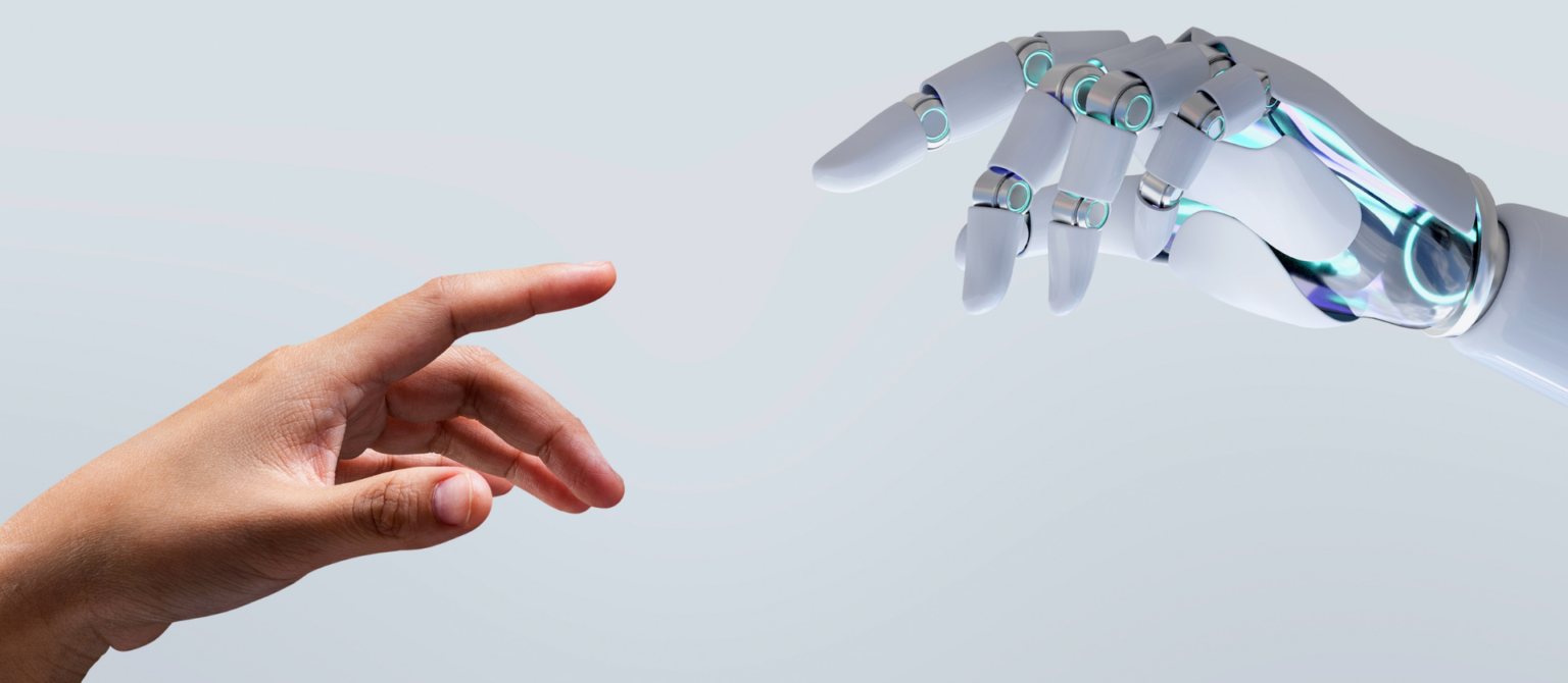 Human hand reaching toward a robotic hand, representing human-first B2B marketing in an AI-driven world.