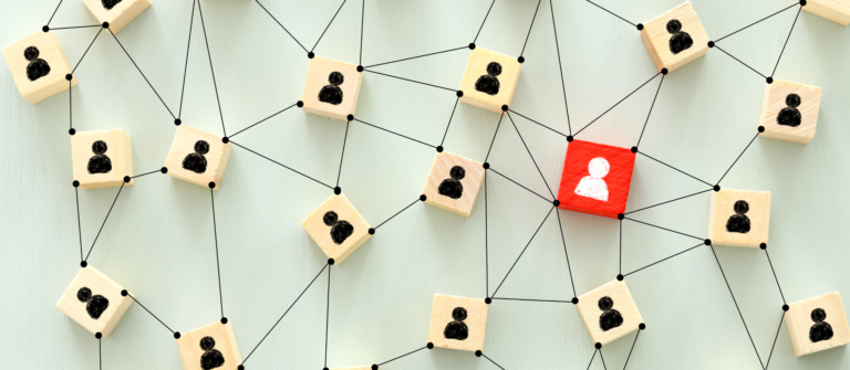 A network of connected icons with one highlighted node illustrate how human content wins in an AI market by standing out through distinct perspective.